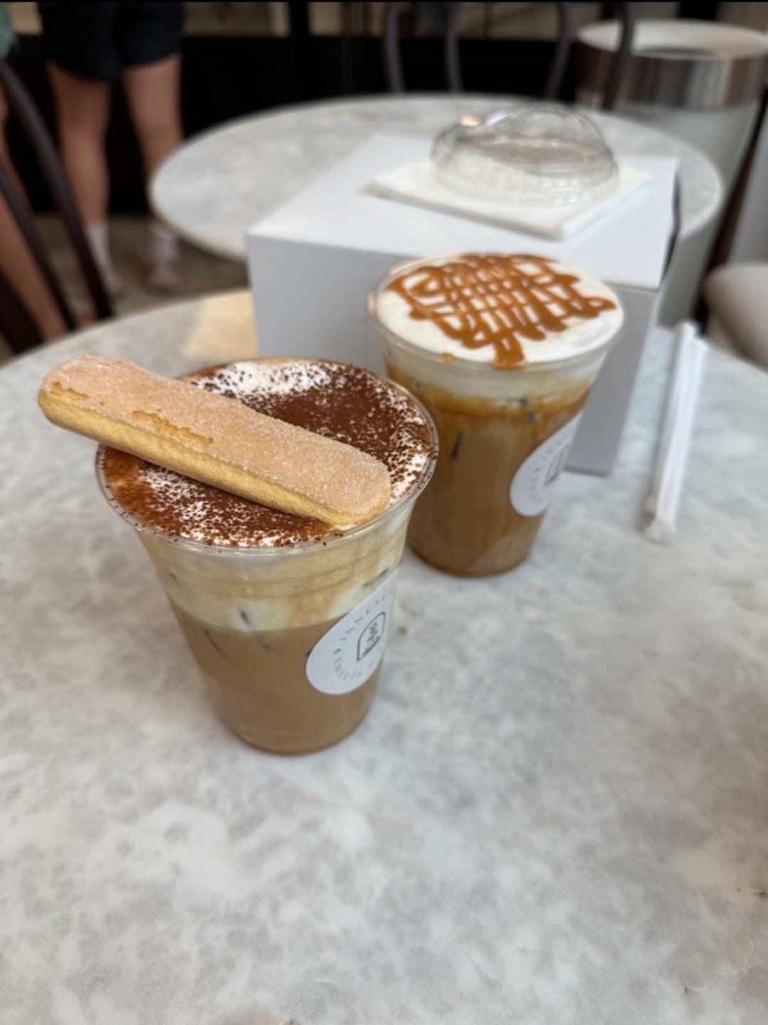 Display case with elegant pastry tarts and mousse cakes